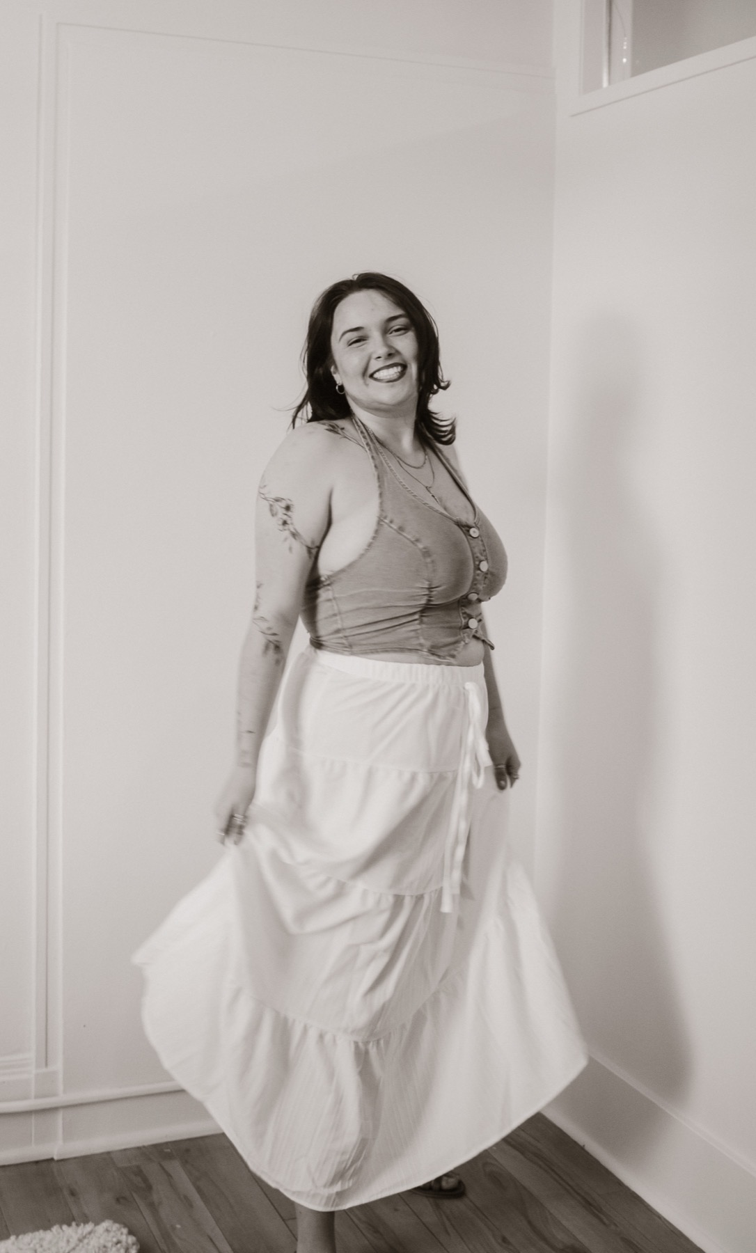 Black and white portrait in motion inside Studio Rose.